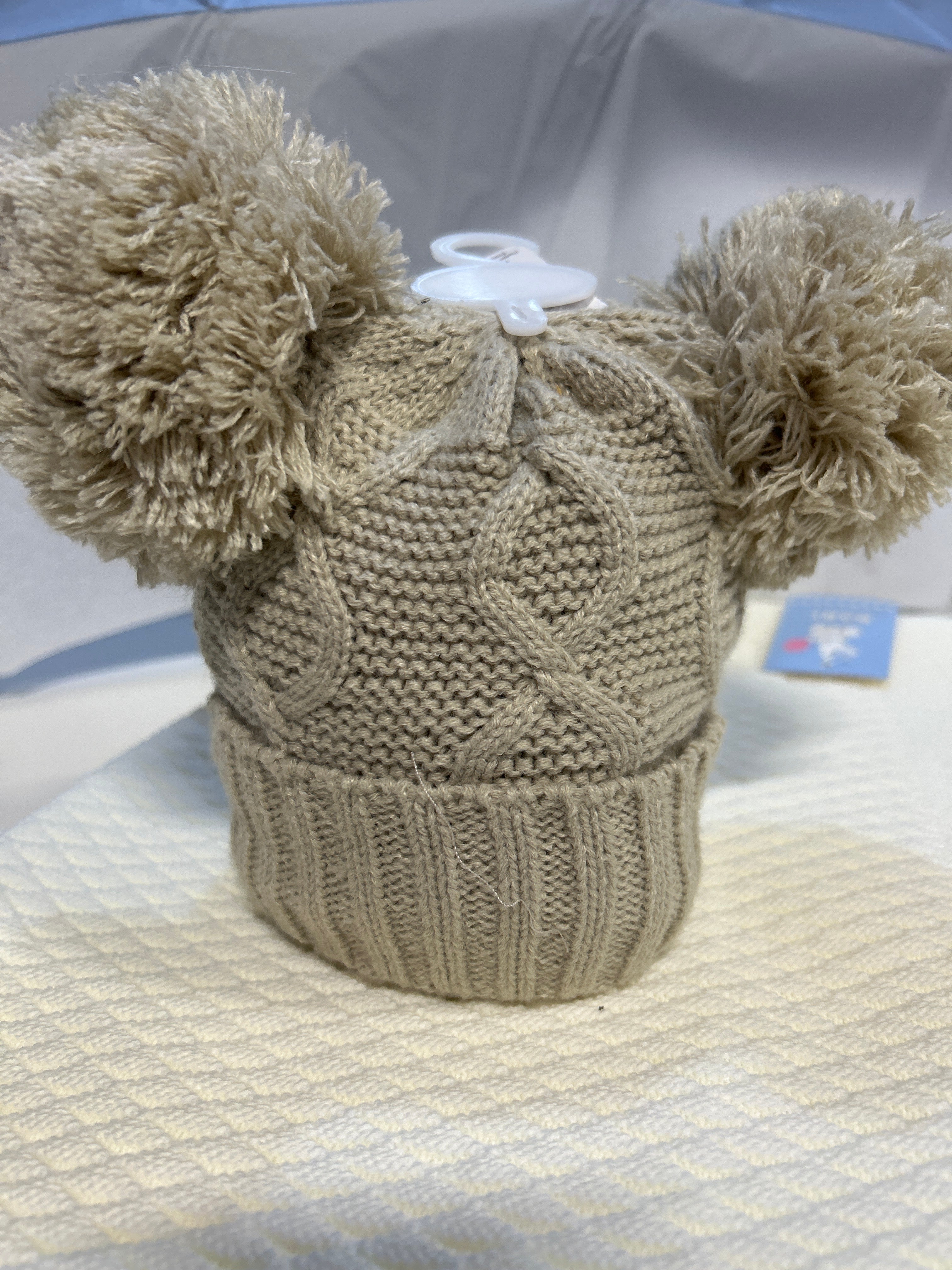 Beige knitted Pom Pom